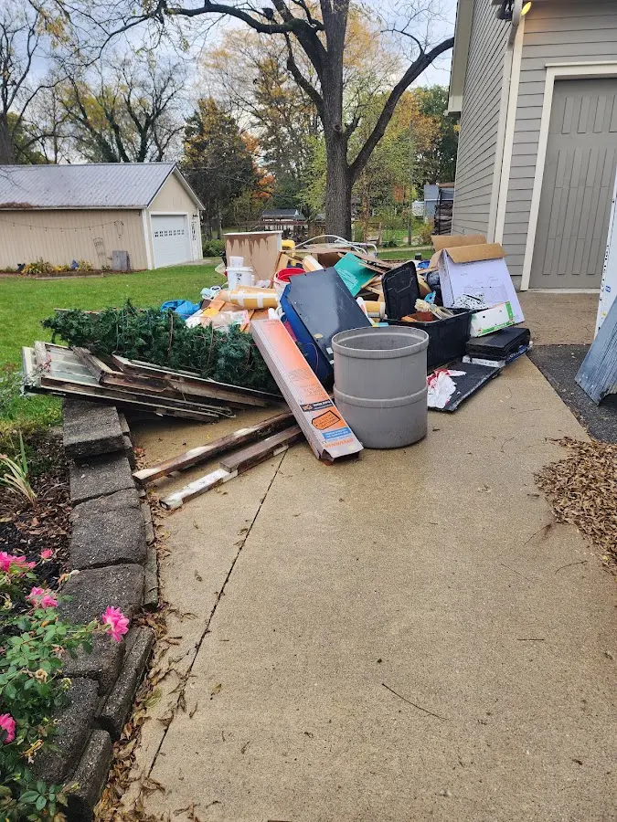 Dumpster being loaded with debris for Roofing Dumpster Rental in Forks